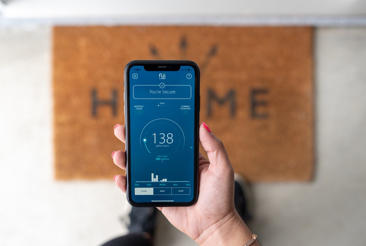 Flo by Moen smart water monitor displayed on a phone screen with water usage data and controls
